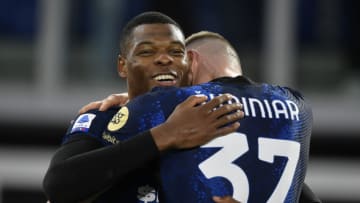 OLIMPICO STADIUM, ROME, ITALY - 2021/12/04: Denzel Dumfries of FC Internazionale (l) celebrates with Milan Skriniar after scoring the goal of 0-3 during the Serie A football match between AS Roma and FC Internazionale. FC Internazionale won 3-0 over AS Roma. (Photo by Antonietta Baldassarre/Insidefoto/LightRocket via Getty Images)