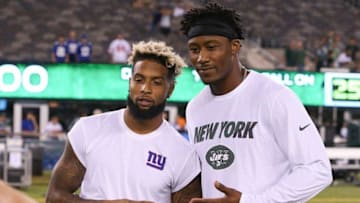 Aug 27, 2016; East Rutherford, NJ, USA; New York Giants wide receiver Odell Beckham (left) and New York Jets wide receiver Brandon Marshall (right) pose for a photo after a preseason game at MetLife Stadium. The Giants won, 21-20. Mandatory Credit: Vincent Carchietta-USA TODAY Sports