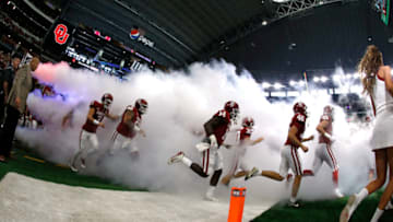 ARLINGTON, TX - DECEMBER 2: The Oklahoma Sooners take the field before playing the TCU Horned Frogs during the first half at AT&T Stadium on December 2, 2017 in Arlington, Texas. OU won 41-17. (Photo by Ron Jenkins/Getty Images)