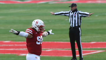 LINCOLN, NE - DECEMBER 12: Defensive lineman Casey Rogers #98 of the Nebraska Cornhuskers signals a stop against the Minnesota Golden Gophers at Memorial Stadium in the first half on December 12, 2020 in Lincoln, Nebraska. (Photo by Steven Branscombe/Getty Images)
