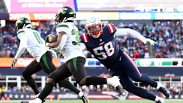 Nov 20, 2022; Foxborough, Massachusetts, USA; New England Patriots linebacker Anfernee Jennings (58) tackles New York Jets running back Michael Carter (32) during the second half at Gillette Stadium. Mandatory Credit: Brian Fluharty-USA TODAY Sports