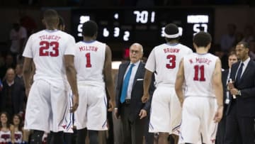 Jan 19, 2016; Dallas, TX, USA; SMU Mustangs head coach Larry Brown talks to forward Jordan Tolbert (23) and guard Shake Milton (1) and guard Sterling Brown (3) and guard Nic Moore (11) during the second half of an NCAA college basketball game against the Houston Cougars at Moody Coliseum. The Mustangs defeat the Cougars 77-73. Mandatory Credit: Jerome Miron-USA TODAY Sports