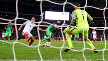 LONDON, ENGLAND - OCTOBER 05: Harry Kane of England (9) scores their first goal past Jan Oblak of Slovenia during the FIFA 2018 World Cup Group F Qualifier between England and Slovenia at Wembley Stadium on October 5, 2017 in London, England. (Photo by Clive Rose/Getty Images)