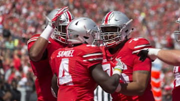 Sep 3, 2016; Columbus, OH, USA; Ohio State Buckeyes running back Curtis Samuel (4) celebrates with teammates after his touchdown in the second quarter against the Bowling Green Falcons at Ohio Stadium. Ohio State won the game 77-10. Mandatory Credit: Greg Bartram-USA TODAY Sports