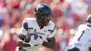 Charles McClelland of the Cincinnati Bearcats runs ball during game against the Arkansas Razorbacks. Getty Images.