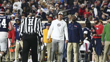 Nov 24, 2022; Oxford, Mississippi, USA; Ole Miss Rebels head coach Lane Kiffin walks onto the field after a play in the first quarter during the game against the Mississippi State Bulldogs at Vaught-Hemingway Stadium. Mandatory Credit: Matt Bush-USA TODAY Sports