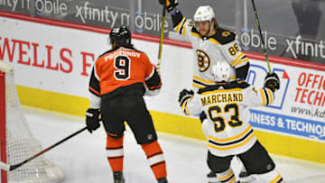 Feb 3, 2021; Philadelphia, Pennsylvania, USA; Boston Bruins right wing David Pastrnak (88) celebrates his goal with center Brad Marchand (63) against Philadelphia Flyers defenseman Ivan Provorov (9) during the first period at Wells Fargo Center. Mandatory Credit: Eric Hartline-USA TODAY Sports