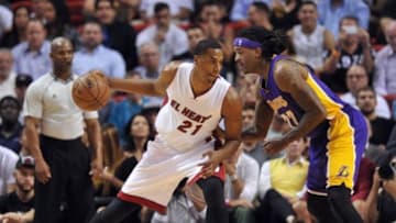 Mar 4, 2015; Miami, FL, USA; Miami Heat center Hassan Whiteside (21) is pressured by Los Angeles Lakers center Jordan Hill (27) during the second half at American Airlines Arena. Mandatory Credit: Steve Mitchell-USA TODAY Sports