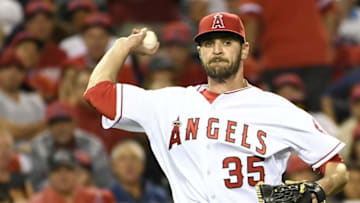 April 22, 2016; Anaheim, CA, USA; Los Angeles Angels starting pitcher Nick Tropeano (35) throws out a runner at first in the sixth inning against Seattle Mariners at Angel Stadium of Anaheim. Mandatory Credit: Richard Mackson-USA TODAY Sports