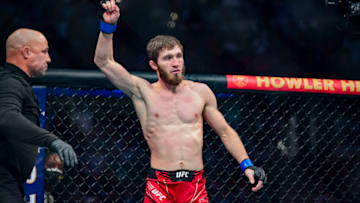 Jan 22, 2022; Anaheim, California, USA; Said Nurmagomedov (blue gloves) celebrates his win by submission against Cody Stamann (red gloves) during UFC 270 at Honda Center. Mandatory Credit: Gary A. Vasquez-USA TODAY Sports