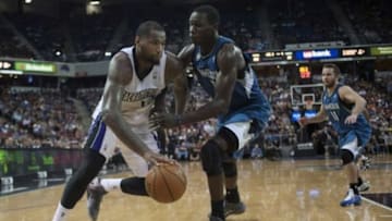 Apr 13, 2014; Sacramento, CA, USA; Sacramento Kings center DeMarcus Cousins (15) drives to the basket against Minnesota Timberwolves center Gorgui Dieng (5) during the fourth quarter at Sleep Train Arena. The Sacramento Kings defeated the Minnesota Timberwolves 106-103. Mandatory Credit: Ed Szczepanski-USA TODAY Sports