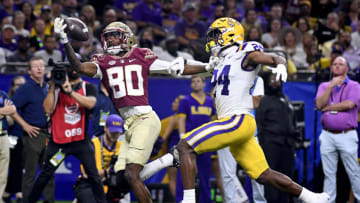 Sep 4, 2022; New Orleans, Louisiana, USA; Florida State Seminoles wide receiver Ontaria Wilson (80) makes a catch past Louisiana State Tigers cornerback Jarrick Bernard-Converse during the second half at Caesars Superdome. Mandatory Credit: Melina Myers-USA TODAY Sports