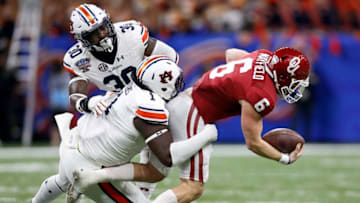 NEW ORLEANS, LA - JANUARY 02: Baker Mayfield #6 of the Oklahoma Sooners is tackled by Montravius Adams #1 of the Auburn Tigers during the Allstate Sugar Bowl at the Mercedes-Benz Superdome on January 2, 2017 in New Orleans, Louisiana. (Photo by Jonathan Bachman/Getty Images)