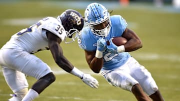 CHAPEL HILL, NC - NOVEMBER 18: Jordon Brown #2 of the North Carolina Tar Heels runs with the ball against Keion Crossen #35 of the Western Carolina Catamounts at Kenan Stadium on November 18, 2017 in Chapel Hill, North Carolina. (Photo by Lance King/Getty Images)