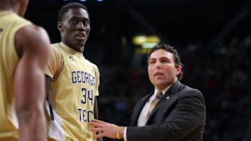 Dec 20, 2016; Atlanta, GA, USA; Georgia Tech Yellow Jackets head coach Josh Pastner talks with guard Josh Okogie (5, left) and forward Abdoulaye Gueye (34) in the first half of their game against the Georgia Bulldogs at McCamish Pavilion. Mandatory Credit: Jason Getz-USA TODAY Sports
