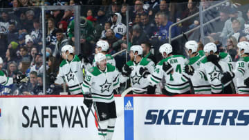 Nov 11, 2023; Winnipeg, Manitoba, CAN; Dallas Stars forward Matt Duchene (95) is congratulated by his teammates on his goal against the Winnipeg Jets during the second period at Canada Life Centre. Mandatory Credit: Terrence Lee-USA TODAY Sports