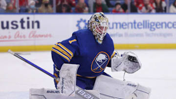 Dec 11, 2021; Buffalo, New York, USA; Buffalo Sabres goaltender Ukko-Pekka Luukkonen (1) looks for the puck during the third period against the Washington Capitals at KeyBank Center. Mandatory Credit: Timothy T. Ludwig-USA TODAY Sports