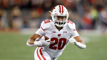 Sep 24, 2022; Columbus, Ohio, USA; Wisconsin Badgers running back Isaac Guerendo (20) runs the ball during the third quarter against the Ohio State Buckeyes at Ohio Stadium. Mandatory Credit: Joseph Maiorana-USA TODAY Sports