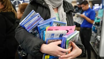 CHICAGO, IL - NOVEMBER 22: A shopper buys video games at a Best Buy Inc. store on November 22, 2018 in Chicago, Illinois. Known as 'Black Friday', the day after Thanksgiving marks the beginning of the holiday shopping season, with many retailers opening their doors on Thursday evening. (Photo by Kamil Krzaczynski/Getty Images)