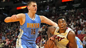 The Denver Nuggets' Nikola Jokic, left, defends ast the Miami Heat's Hassan Whiteside looks to the basket on April 2, 2017, at the AmericanAirlines Arena, Miami. (Charles Trainor Jr./Miami Herald/TNS via Getty Images)