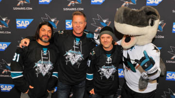 SAN JOSE, CA - JANUARY 21: (L-R) Larry Trujillo, James Hetfield and Lars Ulrich of Metallica receive San Jose Sharks jerseys at Metallica Night At The San Jose Sharks Game on January 21, 2015 in San Jose, California. (Photo by Steve Jennings/Getty Images for BB Gun)