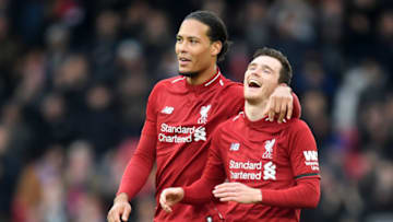 LIVERPOOL, ENGLAND - APRIL 14: Andy Robertson and Virgil van Dijk of Liverpool celebrate victory after the Premier League match between Liverpool FC and Chelsea FC at Anfield on April 14, 2019 in Liverpool, United Kingdom. (Photo by Michael Regan/Getty Images)