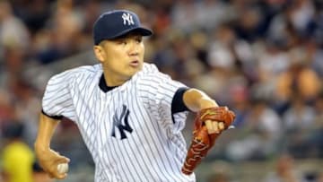 Jun 28, 2014; Bronx, NY, USA; New York Yankees starting pitcher Masahiro Tanaka (19) delivers a pitch during the ninth inning against the Boston Red Sox at Yankee Stadium. Boston Red Sox won 2-1. Mandatory Credit: Anthony Gruppuso-USA TODAY Sports