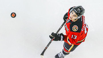 Apr 7, 2016; Calgary, Alberta, CAN; Calgary Flames left wing Johnny Gaudreau (13) controls the puck during the warmup period against the Vancouver Canucks at Scotiabank Saddledome. Mandatory Credit: Sergei Belski-USA TODAY Sports