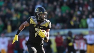 Nov 21, 2015; Eugene, OR, USA; Oregon Ducks wide receiver Darren Carrington (7) runs the ball following a catch against the USC Trojans at Autzen Stadium. Mandatory Credit: Scott Olmos-USA TODAY Sports