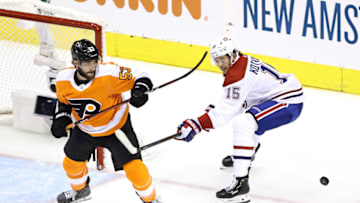 TORONTO, ONTARIO - AUGUST 14: Shayne Gostisbehere #53 of the Philadelphia Flyers looks for the puck against Jesperi Kotkaniemi #15 of the Montreal Canadiens during the first period in Game Two of the Eastern Conference First Round during the 2020 NHL Stanley Cup Playoffs at Scotiabank Arena on August 14, 2020 in Toronto, Ontario, Canada. (Photo by Elsa/Getty Images)