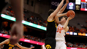 Luka Garza #55 of the Iowa Hawkeyes defends Buddy Boeheim #35 of the Syracuse Orange(Photo by Bryan Bennett/Getty Images)