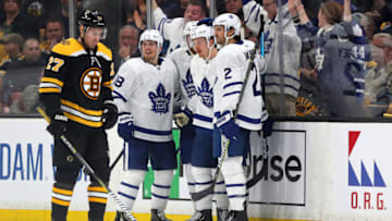 BOSTON, MASSACHUSETTS - APRIL 19: Andreas Johnsson #18 of the Toronto Maple Leafs and Ron Hainsey #2 celebrate with Kasperi Kapanen #24 of the Toronto Maple Leafs after he scored a goal as John Moore #27 of the Boston Bruins looks on during the third period of Game Five of the Eastern Conference First Round during the 2019 NHL Stanley Cup Playoffs at TD Garden on April 19, 2019 in Boston, Massachusetts. The Maple Leafs defeat the Bruins 2-1. (Photo by Maddie Meyer/Getty Images)