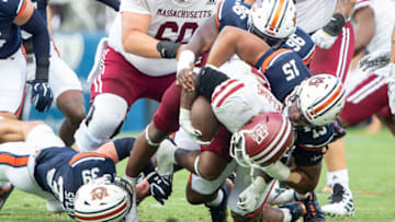 Auburn footballAUBURN, ALABAMA - SEPTEMBER 02: Quarterback Taisun Phommachanh #3 of the Massachusetts Minutemen gets sacked by safety Griffin Speaks #39 of the Auburn Tigers, defensive lineman Keldric Faulk #15 of the Auburn Tigers and defensive lineman Garrison Walker #96 of the Auburn Tigers at Jordan-Hare Stadium on September 02, 2023 in Auburn, Alabama. (Photo by Michael Chang/Getty Images)