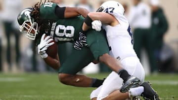EAST LANSING, MI - NOVEMBER 04: Felton Davis III #18 of the Michigan State Spartans battles for yards next to Brandon Smith #47 of the Penn State Nittany Lions during the first half at Spartan Stadium on November 4, 2017 in East Lansing, Michigan. (Photo by Gregory Shamus/Getty Images)