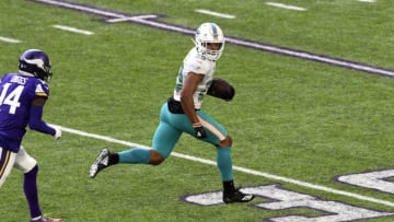 MINNEAPOLIS, MN - DECEMBER 16: Minkah Fitzpatrick #29 of the Miami Dolphins runs with the ball after intercepting a pass by Kirk Cousins #8 of the Minnesota Vikings in the second quarter of the game at U.S. Bank Stadium on December 16, 2018 in Minneapolis, Minnesota. Fitzpatrick scored a 50 yard touchdown on the play. (Photo by Hannah Foslien/Getty Images)