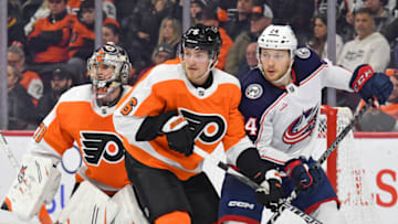 Dec 20, 2022; Philadelphia, Pennsylvania, USA; Columbus Blue Jackets right wing Mathieu Olivier (24) and Philadelphia Flyers defenseman Travis Sanheim (6) battle for position in front of goaltender Carter Hart (79) during the third period at Wells Fargo Center. Mandatory Credit: Eric Hartline-USA TODAY Sports