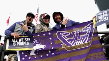 PULLMAN, WA - NOVEMBER 25: Fans for the Washington Huskies cheer for their team against the Washington State Cougars in the second half of the 109th Apple Cup at Martin Stadium on November 25, 2016 in Pullman, Washington. Washington defeated Washington State 45-17. (Photo by William Mancebo/Getty Images)
