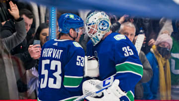 Dec 12, 2021; Vancouver, British Columbia, CAN; Vancouver Canucks forward Bo Horvat (53) and goalie Thatcher Demko (35) celebrate their victory over the Carolina Hurricanes in the third period at Rogers Arena. Vancouver won 2-1. Mandatory Credit: Bob Frid-USA TODAY Sports