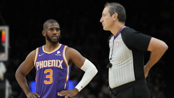 Feb 16, 2022; Phoenix, Arizona, USA; Phoenix Suns guard Chris Paul (3) talks to referee J.T. Orr (right) during the first half against the Houston Rockets at Footprint Center. Mandatory Credit: Rick Scuteri-USA TODAY Sports