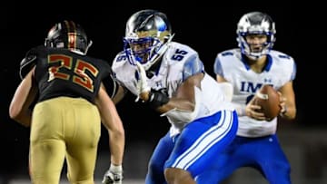IMG Academy's JC Latham (55) defends against Ravenwood's Zack Maaske (25) during the second half at Ravenwood High School in Brentwood, Tenn., Friday, Sept. 25, 2020.Rhs Img 092520 An 022