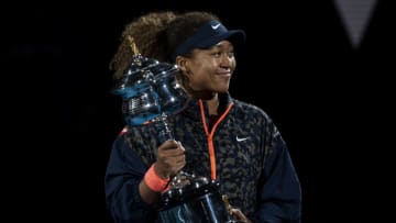 MELBOURNE, AUSTRALIA - FEBRUARY 20: Naomi Osaka of Japan celebrates with the Trophy after defeating Jennifer Brady of the United States in the women's singles final, during day 13 of the 2021 Australian Open at Melbourne Park on February 20, 2021 in Melbourne, Australia. (Photo by TPN/Getty Images)