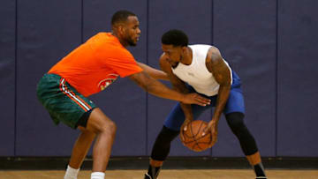 MIAMI, FL - AUGUST 09: Dewan Huell of the Miami Hurricanes defends Udonis Haslem of the Miami Heat during NBA Off-season training with Remy Workouts on August 8, 2018 in Miami, Florida. (Photo by Michael Reaves/Getty Images)