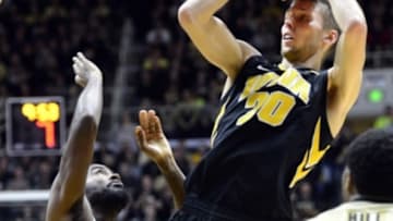 Jan 2, 2016; West Lafayette, IN, USA; Iowa Hawkeyes forward Jarrod Uthoff (20) jumps to shoot the ball over Purdue Boilermakers guard Rapheal Davis (35) during the first half of the game at Mackey Arena. Mandatory Credit: Marc Lebryk-USA TODAY Sports