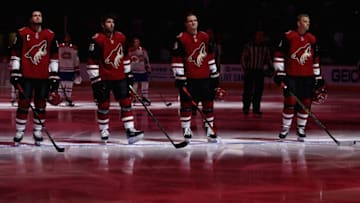GLENDALE, ARIZONA - OCTOBER 30: (L-R) Oliver Ekman-Larsson #23, Jason Demers #55, Christian Fischer #36 and Carl Soderberg #34 of the Arizona Coyotes stand attended for the Canadian national anthem before the NHL game against the Montreal Canadiens at Gila River Arena on October 30, 2019 in Glendale, Arizona. The Canadiens defeated the Coyotes 4-1. (Photo by Christian Petersen/Getty Images)