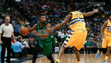 Feb 21, 2016; Denver, CO, USA; Boston Celtics guard Marcus Smart (36) looks to pass against Denver Nuggets forward Will Barton (5) in the second quarter at the Pepsi Center. Mandatory Credit: Isaiah J. Downing-USA TODAY Sports