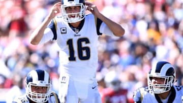LOS ANGELES, CA - SEPTEMBER 16: Jared Goff #16 of the Los Angeles Rams calls a play at the line behind Austin Blythe #66 and Brian Allen #55 during the fourth quarter in a 34-0 win over the Arizona Cardinals at Los Angeles Memorial Coliseum on September 16, 2018 in Los Angeles, California. (Photo by Harry How/Getty Images)