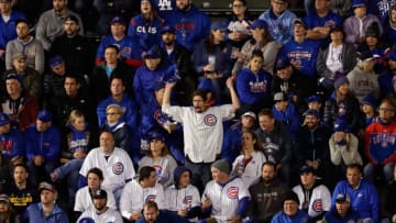 CHICAGO, IL - OCTOBER 17: A fan cheers during game three of the National League Championship Series between the Los Angeles Dodgers and the Chicago Cubs at Wrigley Field on October 17, 2017 in Chicago, Illinois. (Photo by Jamie Squire/Getty Images)