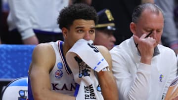 DES MOINES, IOWA - MARCH 18: Kevin McCullar Jr. #15 of the Kansas Jayhawks looks on from the bench late in the second half against the Arkansas Razorbacks in the second round of the NCAA Men's Basketball Tournament at Wells Fargo Arena on March 18, 2023 in Des Moines, Iowa. (Photo by Michael Reaves/Getty Images)