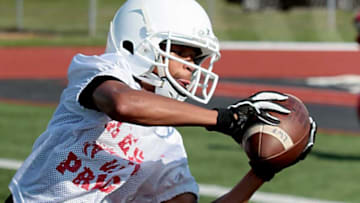 Lakota West receiver Malik Hartford with a reception during the first day of football practice at the school in West Chester Township Thursday, Aug. 1, 2019.Lakota West 10