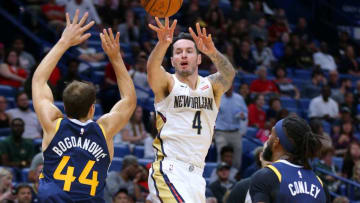 NEW ORLEANS, LOUISIANA - OCTOBER 11: JJ Redick #4 of the New Orleans Pelicans passes around Bojan Bogdanovic #44 of the Utah Jazz during the second half of a game at the Smoothie King Center on October 11, 2019 in New Orleans, Louisiana. (Photo by Jonathan Bachman/Getty Images)